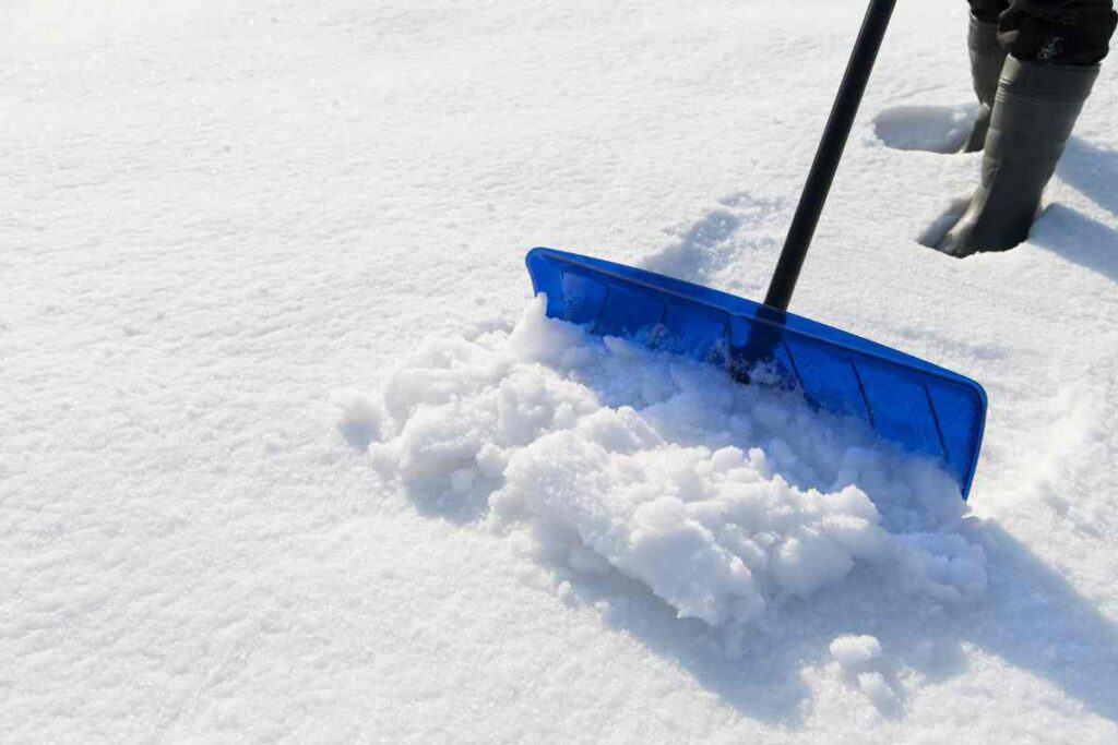shoveling the snow in the winter