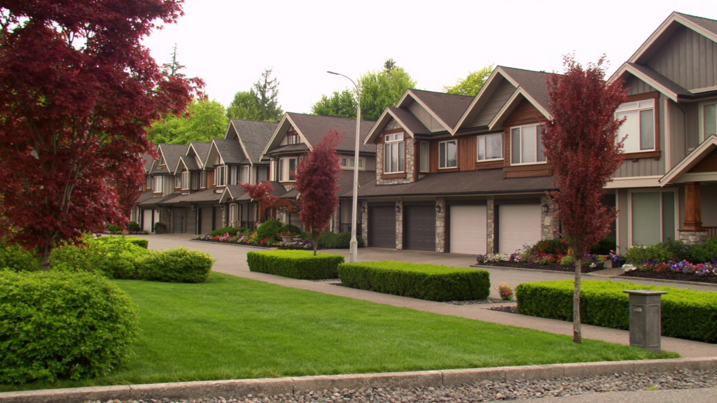 Row of townhouses in a BC strata complex with maintained grounds